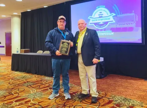 Matt Humphreys with his award and Jay Ball at 2024 International Aviation Snow Symposium